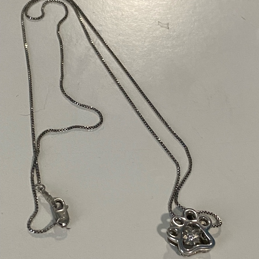 Sterling silver and diamond paw necklace on 18” chain
